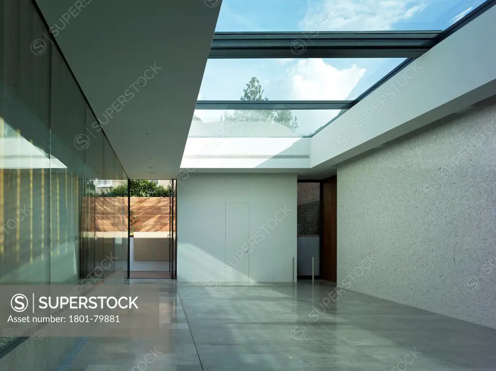 Private House, London, United Kingdom. Architect: Alan Higgs Architects, 2012. Pool Room With The Floor Raised Showing View To Exterior And Roof Lights.