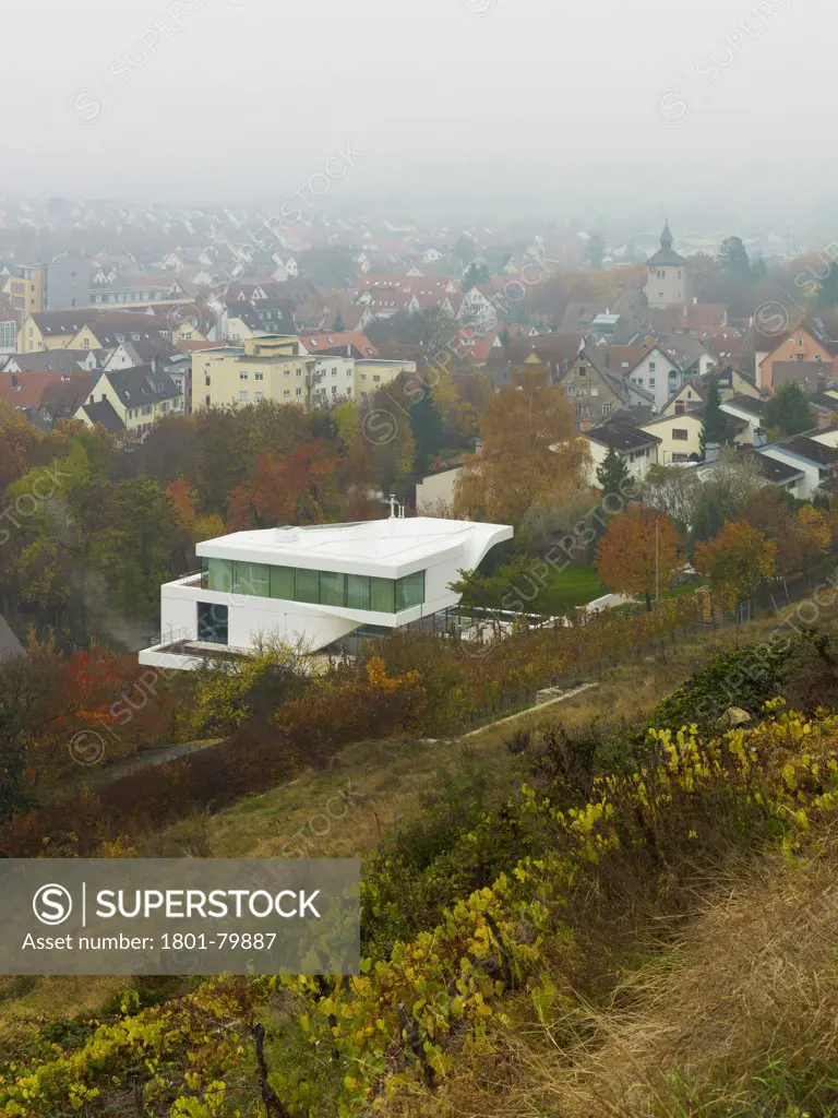 Haus Am Weinberg, Stuttgart, Germany. Architect: Un Studio, 2011. Elevated View Of Villa Embedded In Vineyard With Cityscape Beyond.