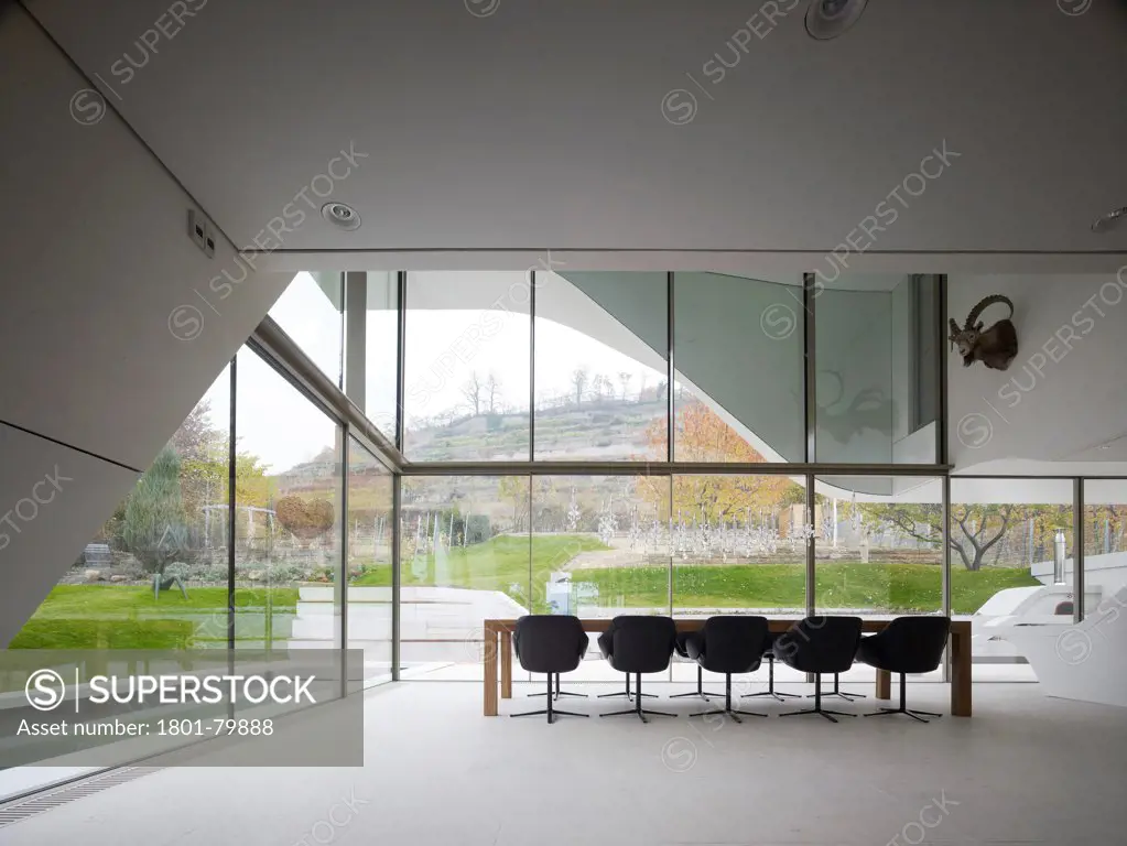 Haus Am Weinberg, Stuttgart, Germany. Architect: Un Studio, 2011. Dining Area With Double-Height, Glazed Corner And View Of Garden.