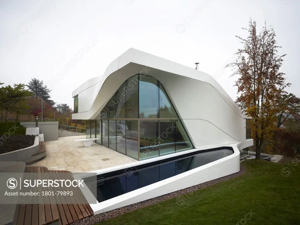 Haus Am Weinberg, Stuttgart, Germany. Architect: Un Studio, 2011. Curved, All White Concrete Structure With Corner Glazing And Outdoor Pool In Landscaped Garden.