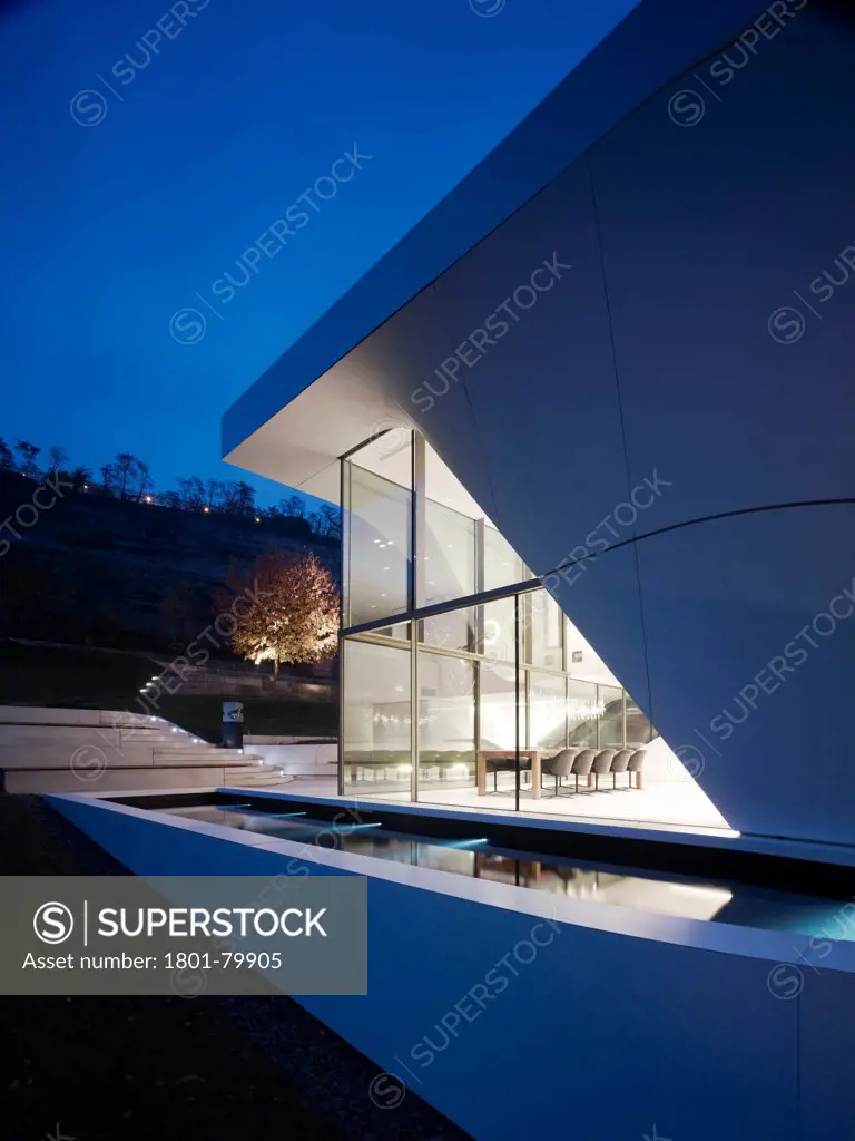 Haus Am Weinberg, Stuttgart, Germany. Architect: Un Studio, 2011. Dusk Elevation Of Full-Height Corner Glazing.