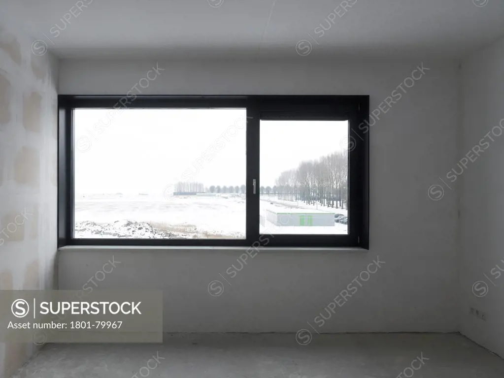 Housing Blaricummermeent, Blaricum, Netherlands. Architect: Casanova + Hernandez Architects, 2012. View Through From Unfinished Interior To Winter Landscape.