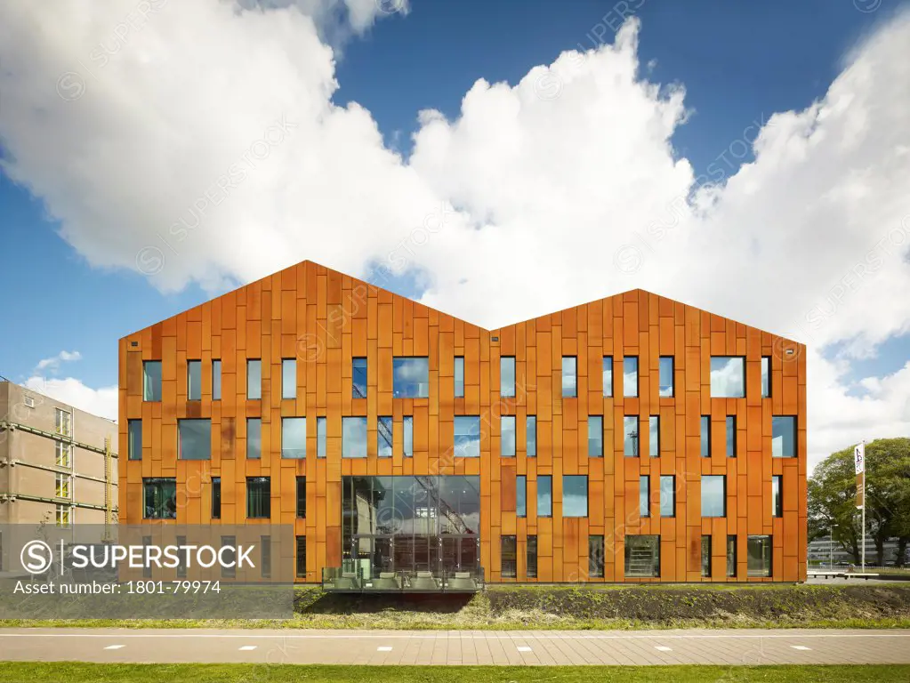 Amsterdam University College, Amstderdam, Netherlands. Architect: Mecanoo, 2012. Lateral Elevation With  Glazed Ground Floor Balcony Protruding Canal.