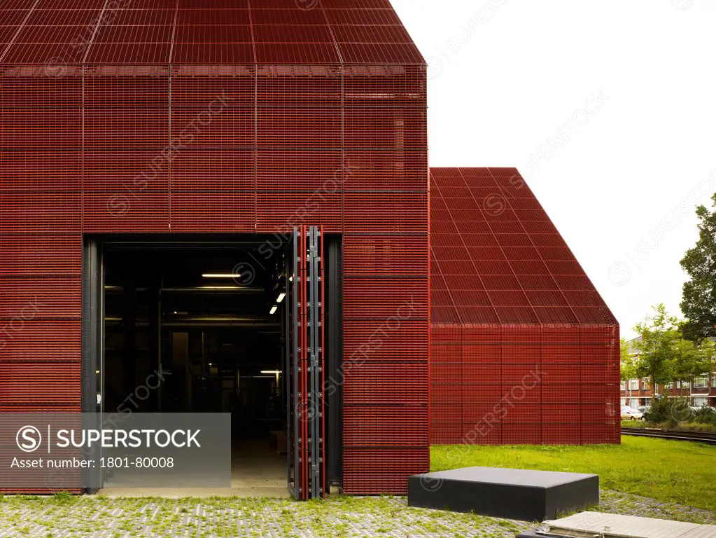 The Hague Geothermal Station, The Hague, Netherlands. Architect: Jan Splinter, 2012. Building Facade With Industrial Concertina Door.