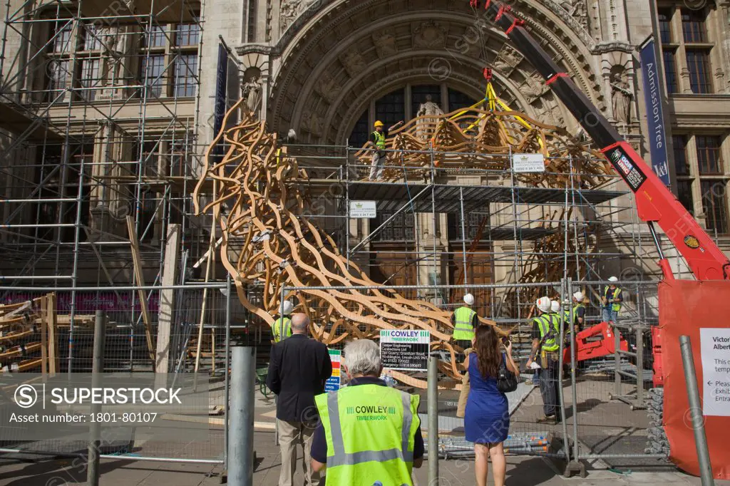 Timber Wave, Installation For London Design Festival 2011, London, United Kingdom. Architect: Al_A, 2011. Sculpture Under Construction With Passersby.