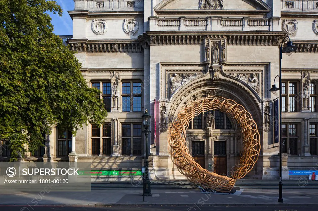 Timber Wave, Installation For London Design Festival 2011, London, United Kingdom. Architect: Al_A, 2011. Sunlit View Through Timber Sculpture And V & A Entrance.