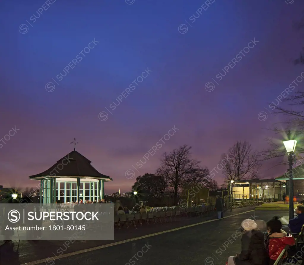 Horniman Pavilion, London, United Kingdom. Architect: Walters And Cohen Ltd, 2012. Night View With Illuminated Bandstand And City'S Skyline.