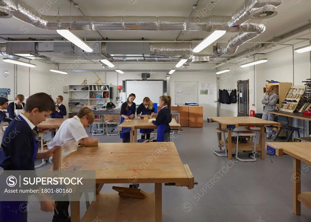 Stanley Park High School, Sutton, United Kingdom. Architect: Haverstock Associates Llp, 2012. Look Into The Design And Technology Room With Students At Work.