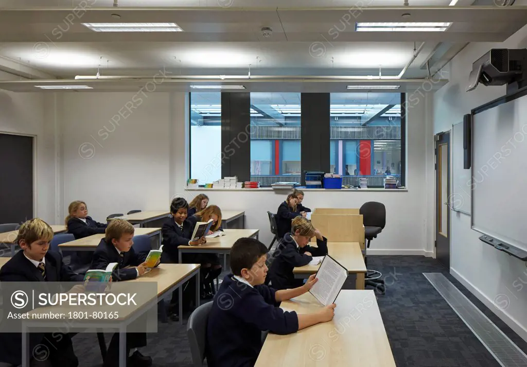 Stanley Park High School, Sutton, United Kingdom. Architect: Haverstock Associates Llp, 2012. Classroom Interior With Students Reading.