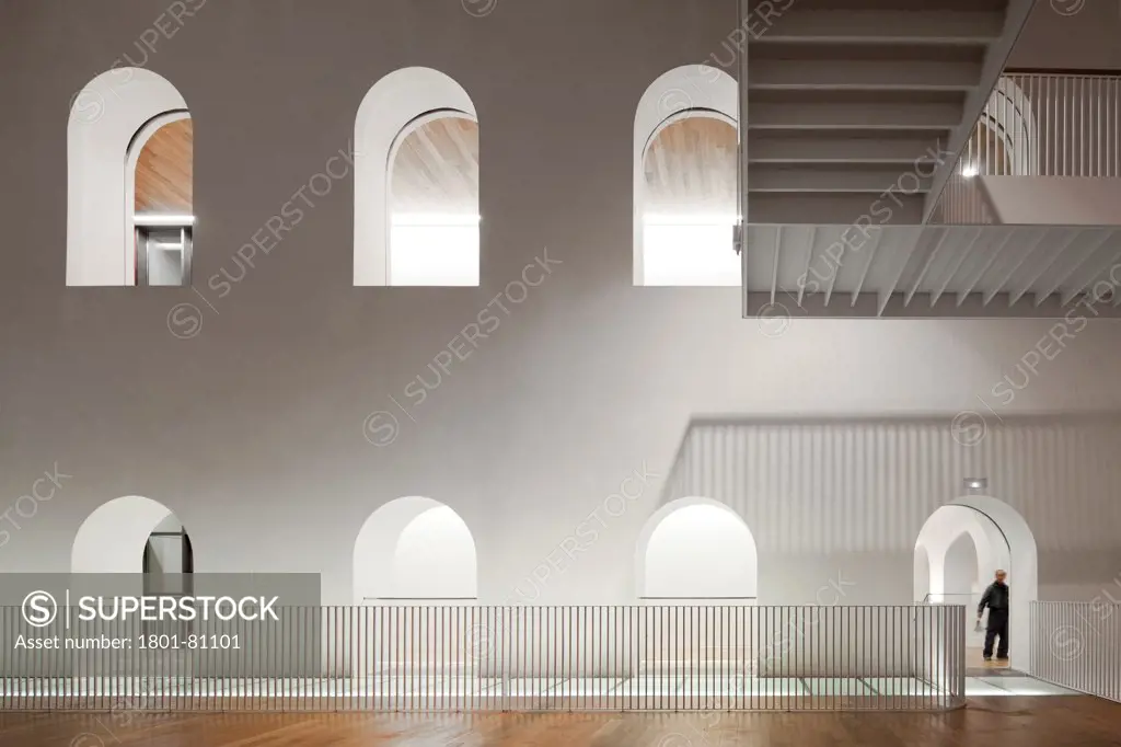 Palacio De Justicia In Burgos, Burgos, Spain. Architect: Primitivo Gonzalez Arquitecto, 2012. Atmospheric View To Double-Height Patio.
