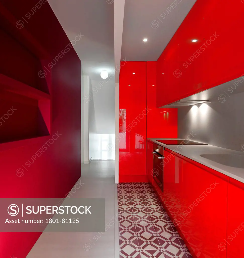 Casa Em Almada, Almada, Portugal. Architect: Pedro Gadanho, 2012. View Through Red Coloured Bespoke Kitchenette.