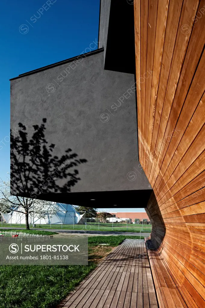 Vitra Haus, Weil Am Rhein, Germany. Architect: Herzog De Meuron, 2010. Perspective Of Timber Cladding And Charcoal Render Facade.