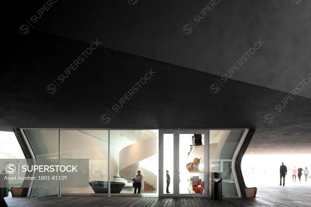 Vitra Haus, Weil Am Rhein, Germany. Architect: Herzog De Meuron, 2010. Juxtaposition Of Exhibition Space And Exterior Canopied Forecourt.