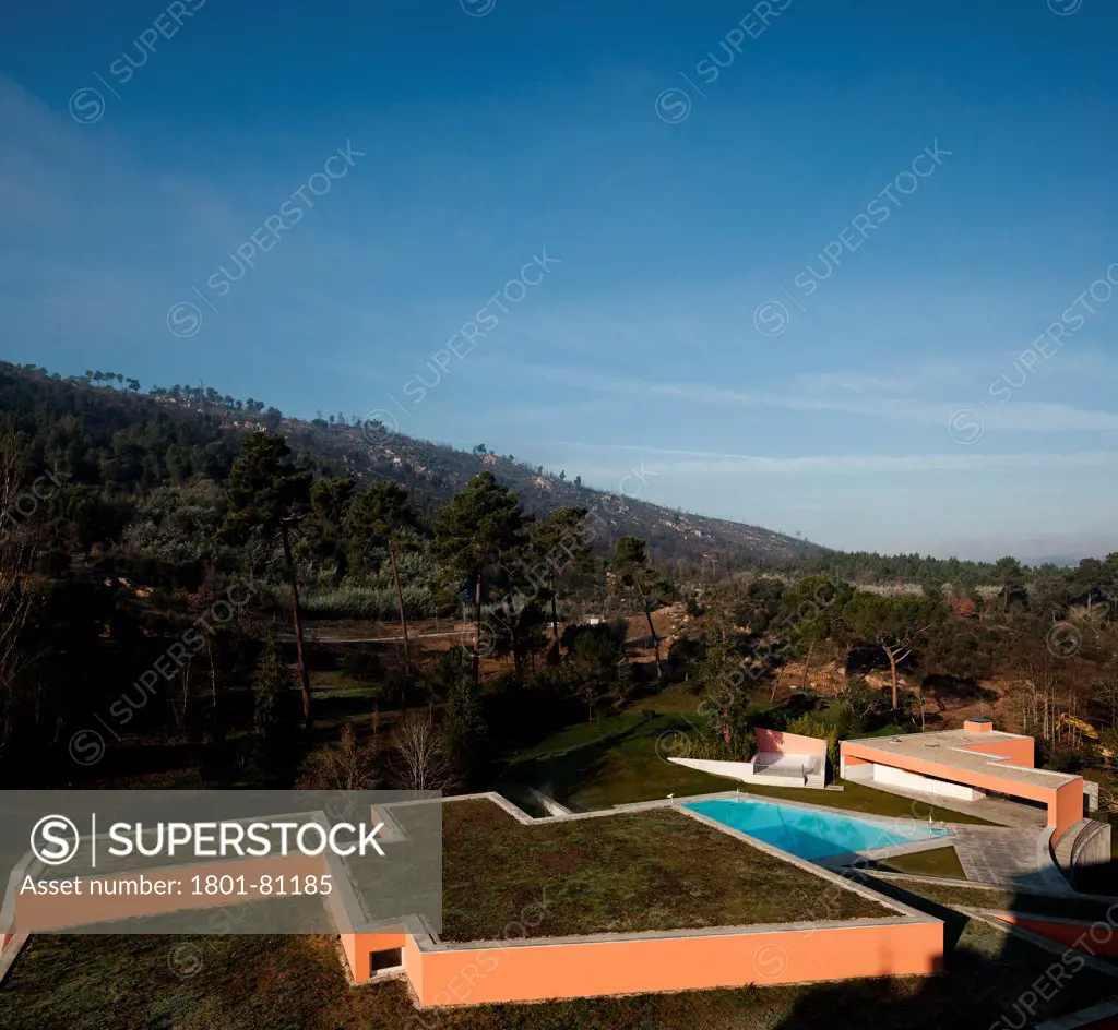 Vidago Palace & Spa, Vidago, Portugal. Architect: Alvaro Siza-Vieira, 2012. Comprehensive Elevated View Of Extension With Green Roof And Parkland.