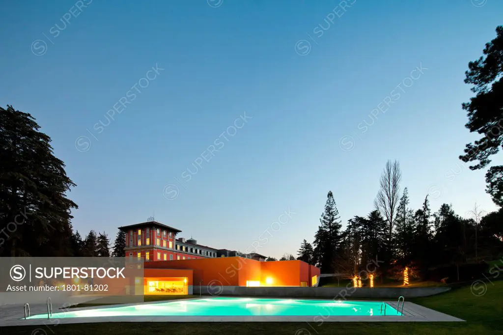 Vidago Palace & Spa, Vidago, Portugal. Architect: Alvaro Siza-Vieira, 2012. Dusk View Of Outdoor Pool And Context.