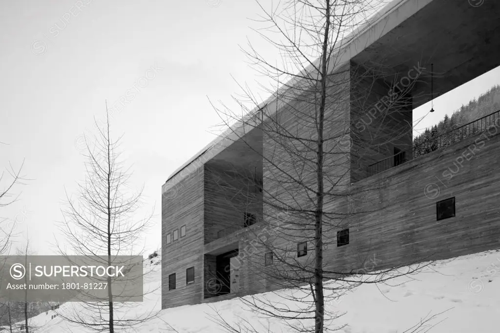 Vals Thermal Baths, Vals, Switzerland. Architect: Peter Zumthor, 1996. Grey Facade Perspective With Snow.