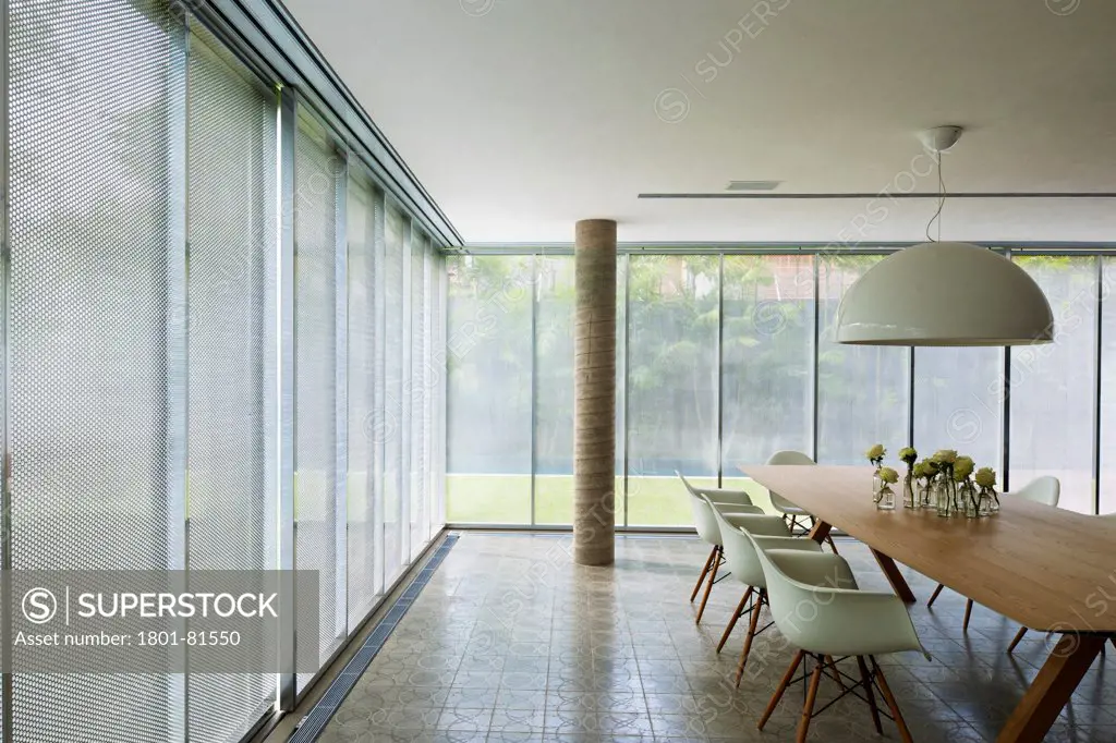 Casa Cubo, Sao Paulo, Brazil. Architect: Studio Mk27- Marcio Kogan, 2012. Interior Showing Perforated Metal Screens  Closed.