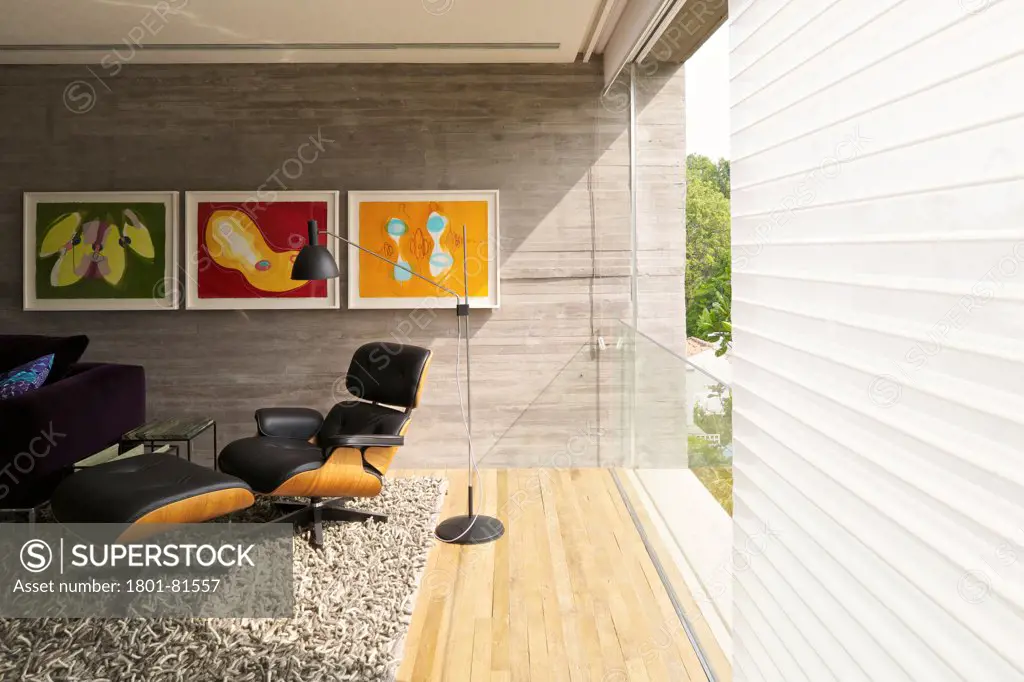 Casa Cubo, Sao Paulo, Brazil. Architect: Studio Mk27- Marcio Kogan, 2012. First Floor View With Eames Lounge Chair.