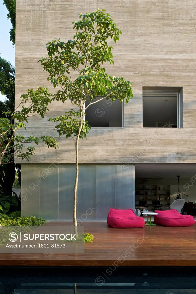 Casa Cubo, Sao Paulo, Brazil. Architect: Studio Mk27- Marcio Kogan, 2012. Facade Detail With Timber Dck.