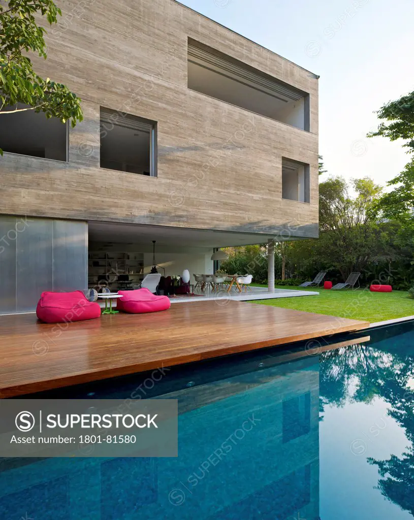 Casa Cubo, Sao Paulo, Brazil. Architect: Studio Mk27- Marcio Kogan, 2012. Exterior View With Reflection On Swimming Pool.