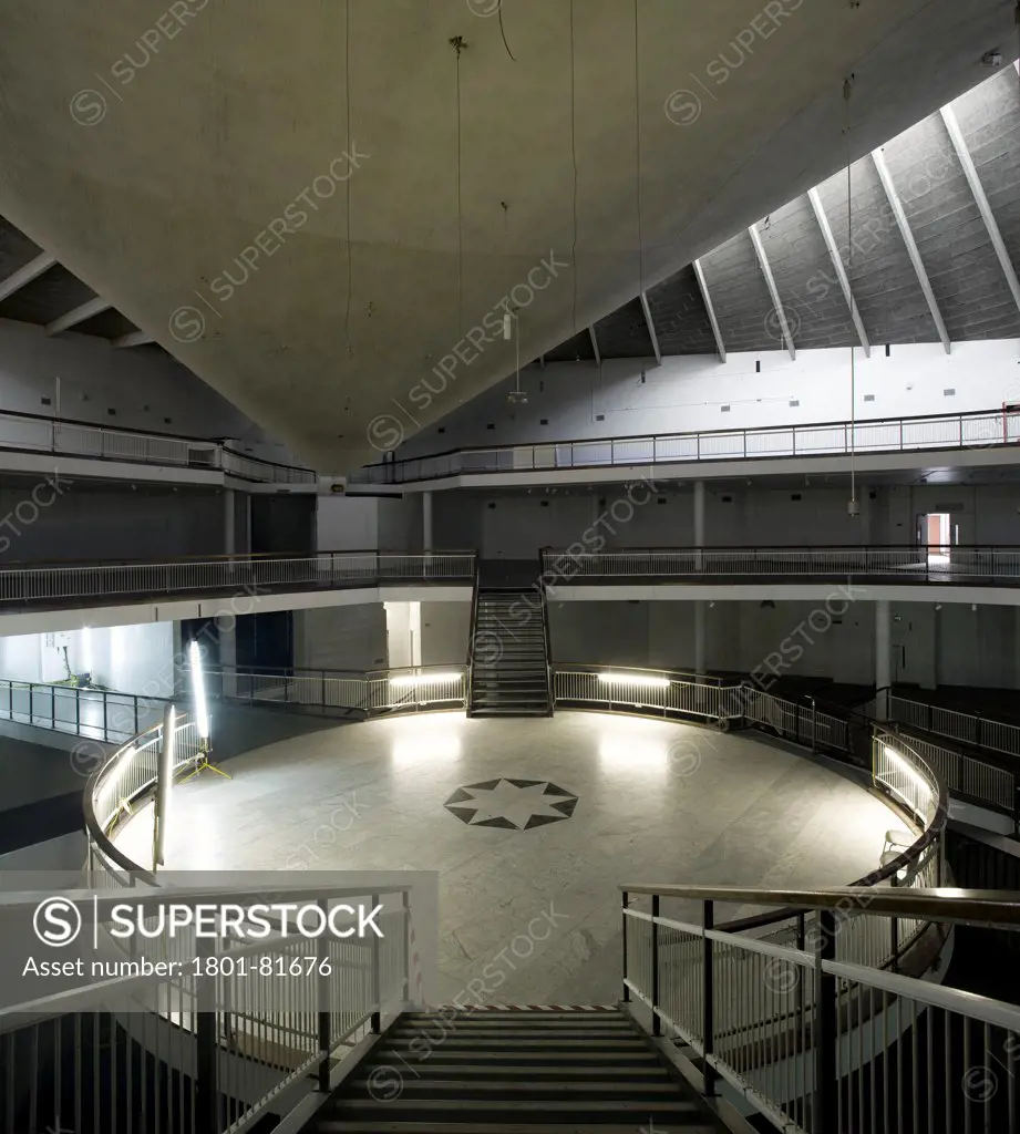 Commonwealth Institute, London, United Kingdom. Architect: Rmjm London Ltd, 1962. Main Hall Interior Looking Down Stairs To Central Platform.