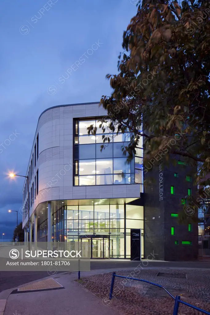 Rotherham College Of Arts & Technology, Rotherham, United Kingdom. Architect: Bond Bryan Architects Ltd, 2011. Perspective From Street With Lit Interior At Dusk.