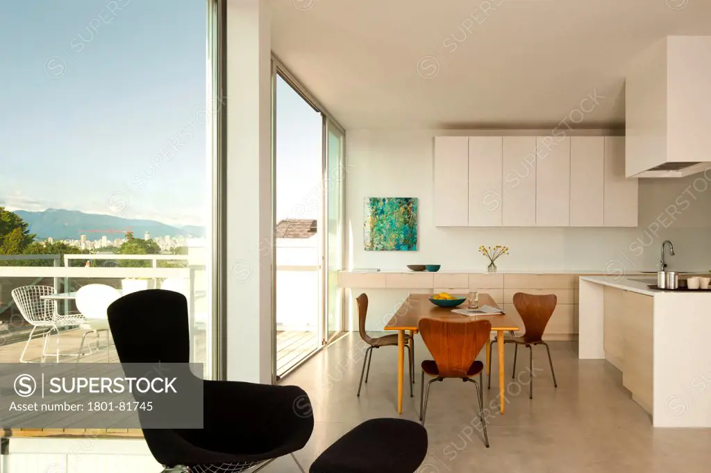 Monad, Vancouver, Canada. Architect:  Lwpac, 2012. Open Plan Kitchen And Dining Area With View Of Balcony.