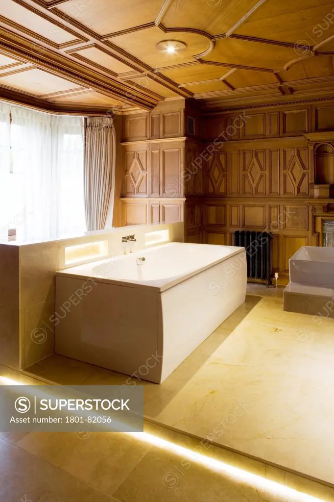 Wood Norton Hotel, Evesham, United Kingdom. Architect: Claridge Architects Ltd, 2013. View Of Bath In Ornate Wooden Panelled Bathroom.