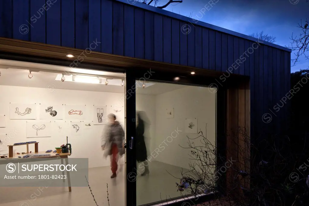 Ecospace Artist Studio Blackheath, London, United Kingdom. Architect: ecospace, 2012. Oblique view through at dusk.