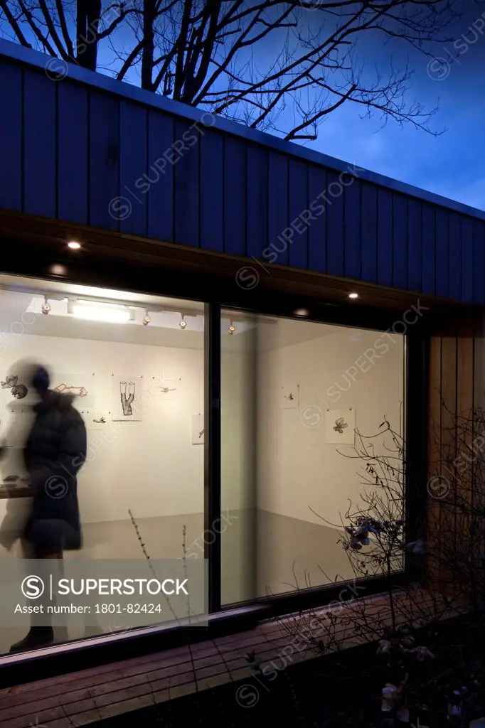 Ecospace Artist Studio Blackheath, London, United Kingdom. Architect: ecospace, 2012. Oblique view through at dusk.
