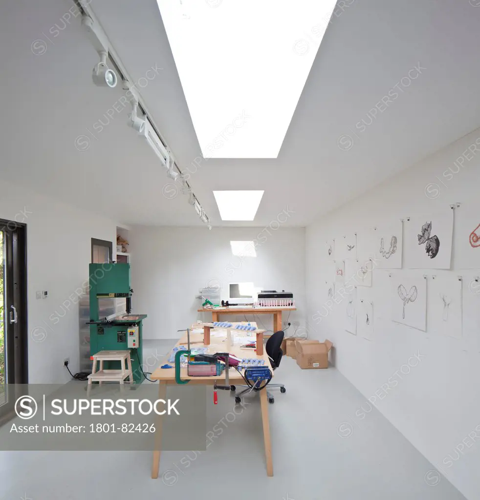 Ecospace Artist Studio Blackheath, London, United Kingdom. Architect: ecospace, 2012. Studio interior with artists desk and rooflight.