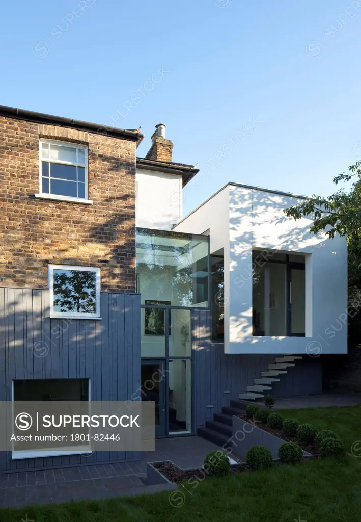 The Cut And Fold House, Twickenham, United Kingdom. Architect: Ashton Porter Architects, 2011. Rear elevation showing the overall extension.