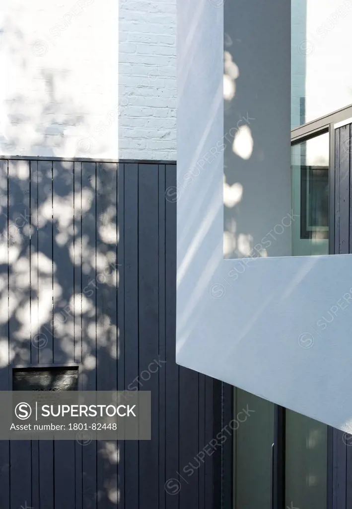The Cut And Fold House, Twickenham, United Kingdom. Architect: Ashton Porter Architects, 2011. Exterior detail showing the corner of the overhanging extension.