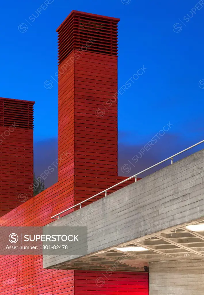 The Shed, London, United Kingdom. Architect: Haworth Tompkins Limited, 2013. Detail of the ventilation tower of The Shed, juxtaposed with the concrete of the National Theatre.
