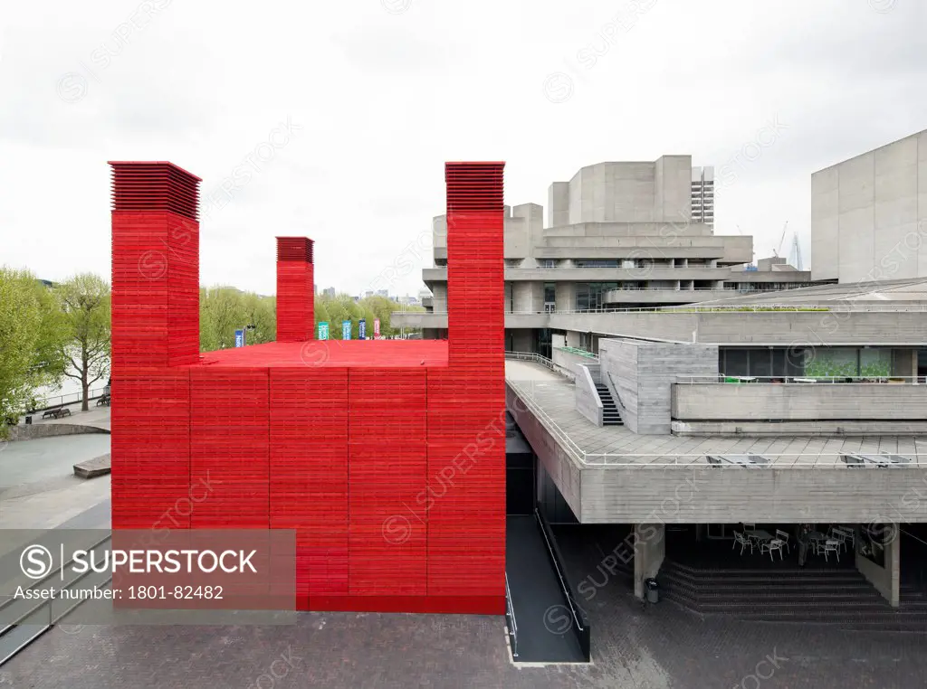 The Shed, London, United Kingdom. Architect: Haworth Tompkins Limited, 2013. View of The Shed looking east, showing the influence of the National Theatre on its design, view taken from Waterloo Bridge.