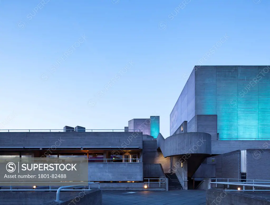 Royal National Theatre, London, United Kingdom. Architect: Denys Lasdun, 1975. View at dusk looking at the east facade and staircase with uplighting.
