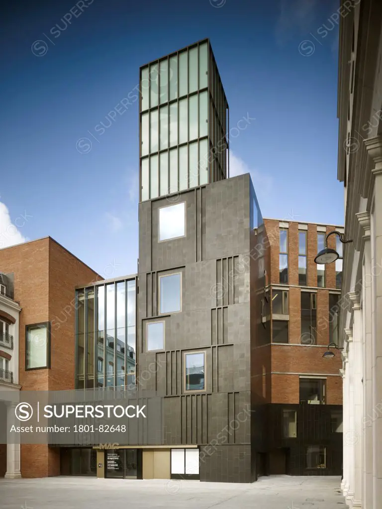 MAC, Belfast, Belfast, United Kingdom. Architect: Hall McKnight, 2012. General exterior elevation with glazed tower on top of basalt facade.