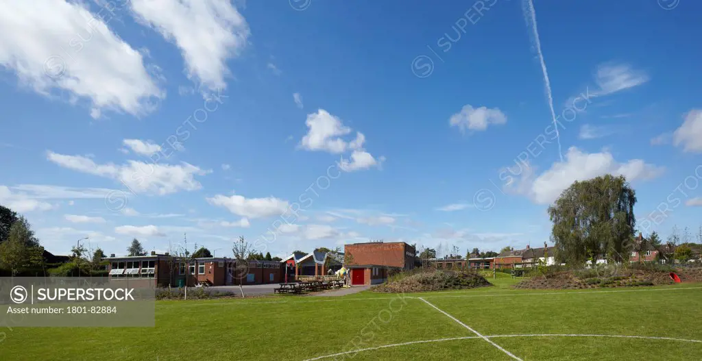 The Winchcombe School, Newbury, United Kingdom. Architect: Architype Limited, 2012. Panoramic view across playground and school garden.