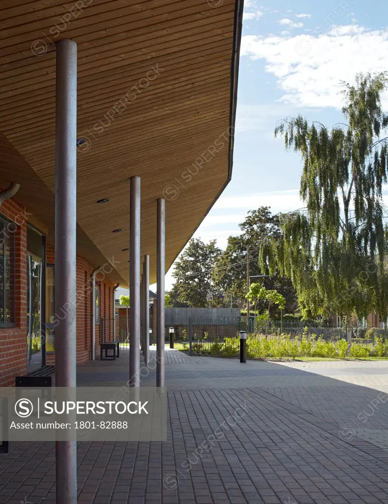 The Winchcombe School, Newbury, United Kingdom. Architect: Architype Limited, 2012. Canopy with timber cladding and metal columns.