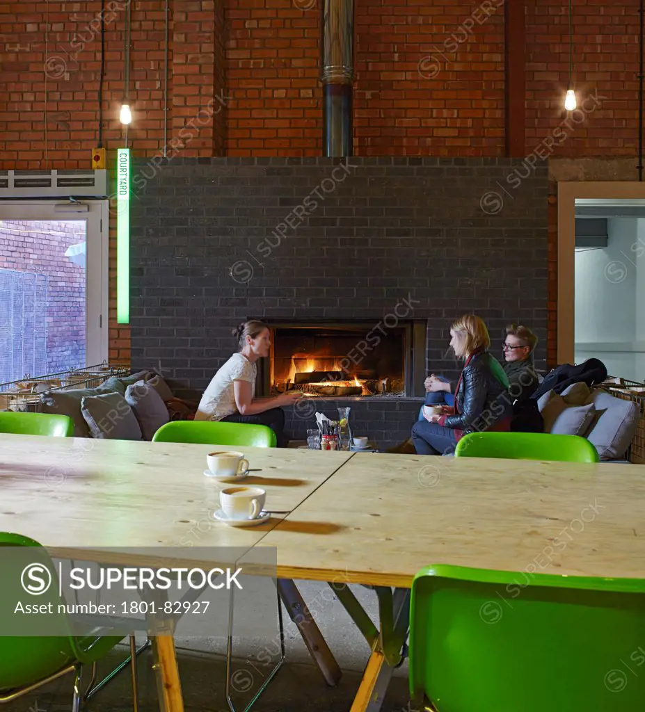 Camp and Furnace, Liverpool, United Kingdom. Architect: FWMA+ and Smiling Wolf, 2012. Details of plywood table and fireplace in reception and eatery.