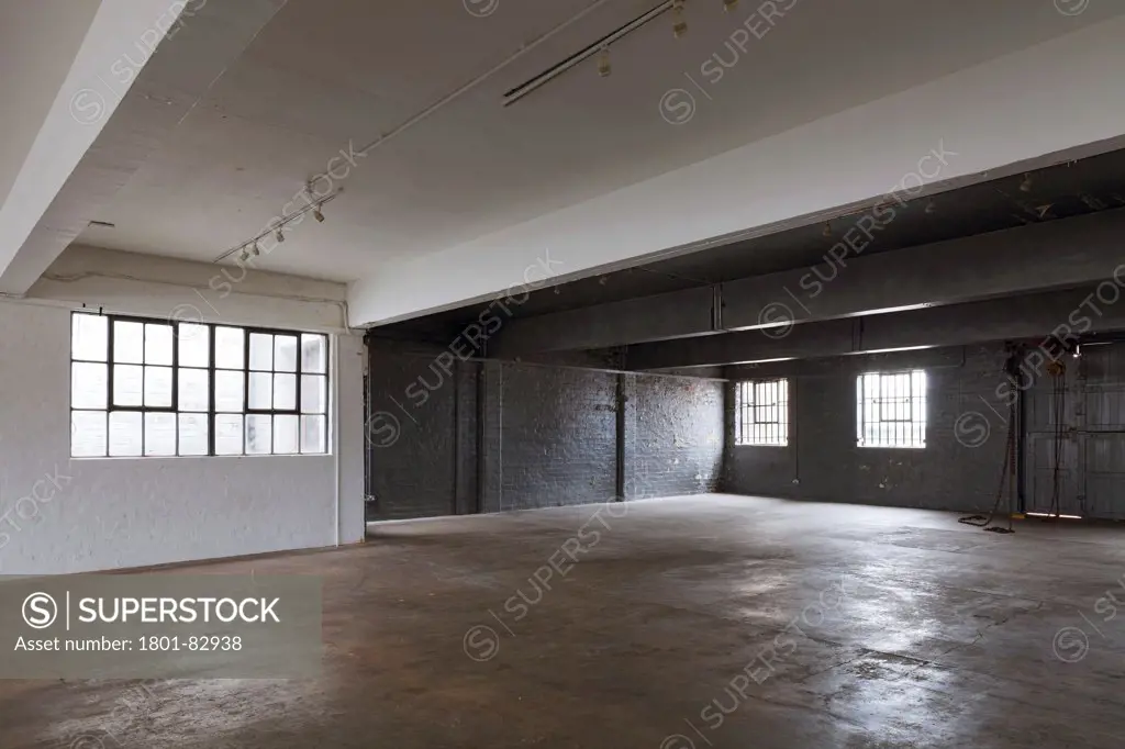Camp and Furnace, Liverpool, United Kingdom. Architect: FWMA+ and Smiling Wolf, 2012. Oblique view through unfurnished studio space.