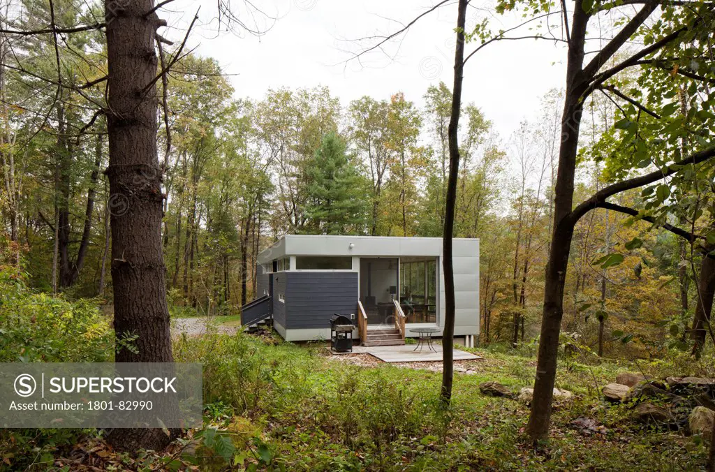 Mill River, The Berkshires, United States. Architect: Rocio Romero, 2011. View from the grounds towards partially glazed living area.