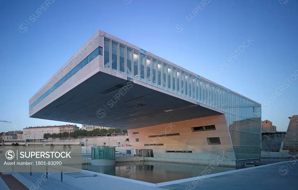 Villa Mediterranee, Marseilles, France. Architect: Stefano Boeri, 2013. Centre projecting above water basin and context.