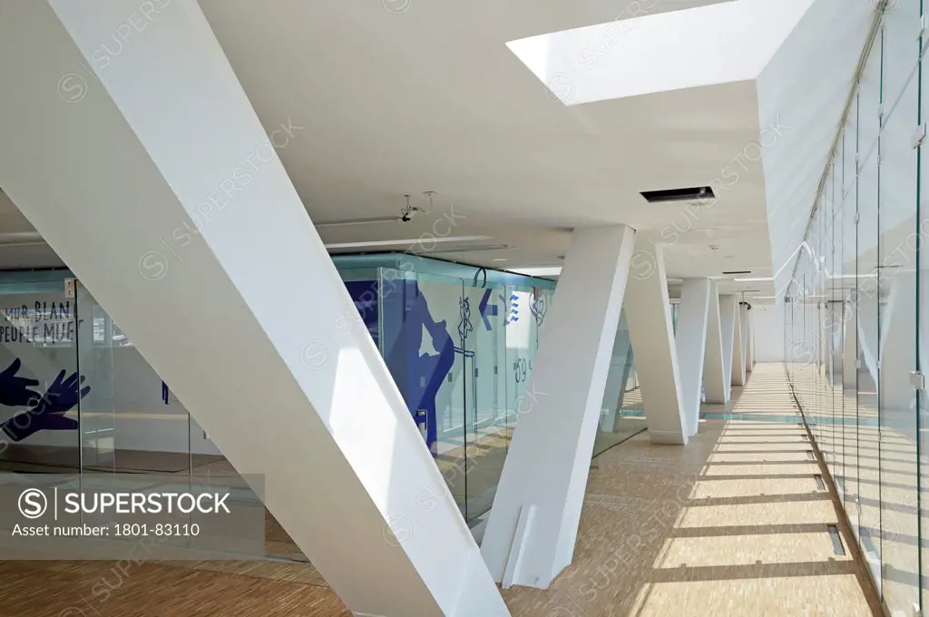 Villa Mediterranee, Marseilles, France. Architect: Stefano Boeri, 2013. Perspective of corridor with structural beams and graphic murals.