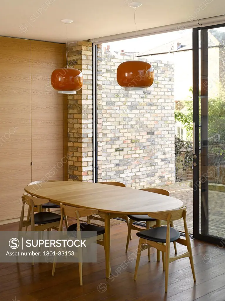 Farrer House, London, United Kingdom. Architect: West Architecture, 2013. Overall interior view showing dining room table.