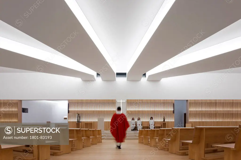 Igreja de Nossa Senhora das Necessidades, Leiria, Portugal. Architect: Bica Arquitectos, 2012. View into main assembly hall with zenith lighting ceiling.