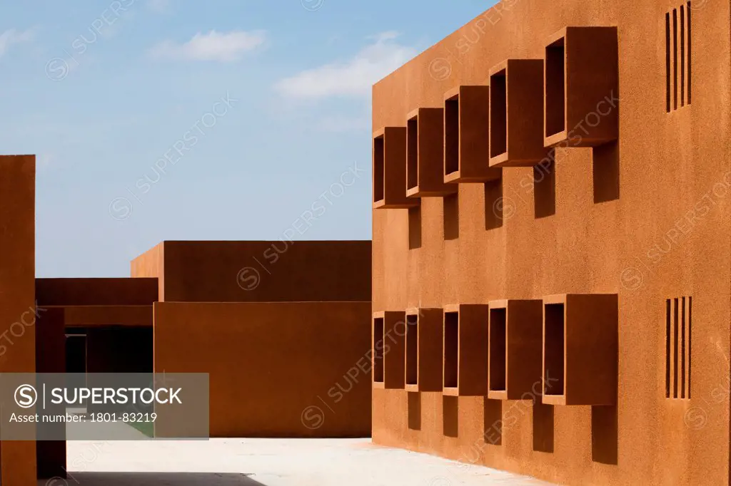 Technology School of Guelmim Morocco, Guelmim, Morocco. Architect: Saad El Kabbaj, Driss Kettani, Mohamed Amine Siana, 2011. Perspective of building facade with square projecting window openings.