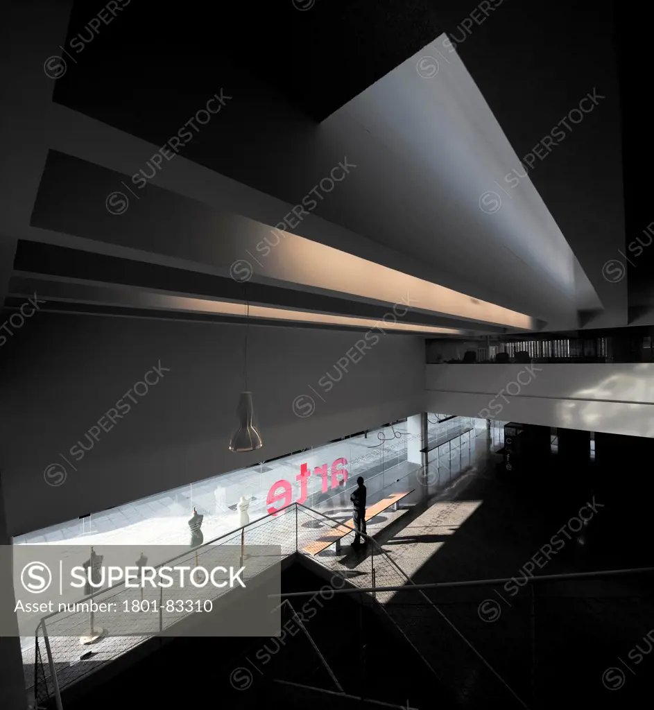 Burgos Art School, Burgos, Spain. Architect: Primitivo Gonzalez, 2011. Elevated dramatic view to glazed foyer.