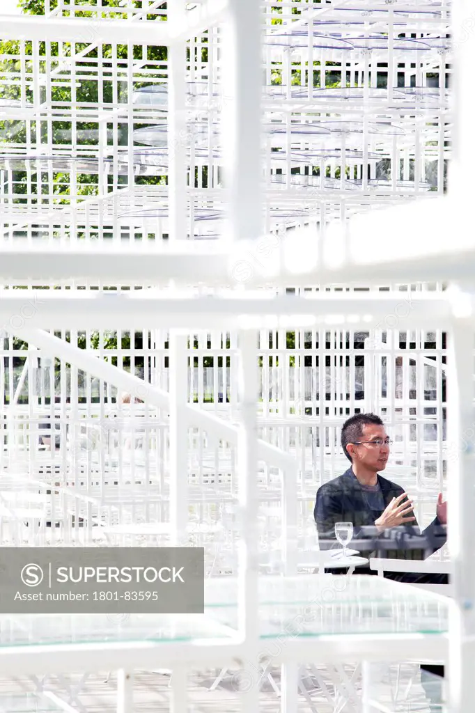 Serpentine Pavilion 2013, London, United Kingdom. Architect: Sou Fujimoto, 2013. Portrait of the architect within the pavilion.