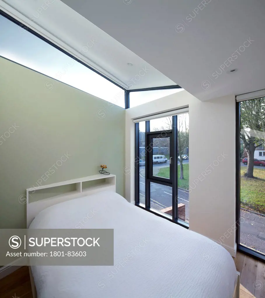 Solna, London, United Kingdom. Architect: Giles Pike Architects and Interior Designers, 2012. Bedroom area showing angular elevated roof window.